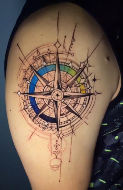 compass cardinal directions geometric circles intricate linework tattoo male bicep