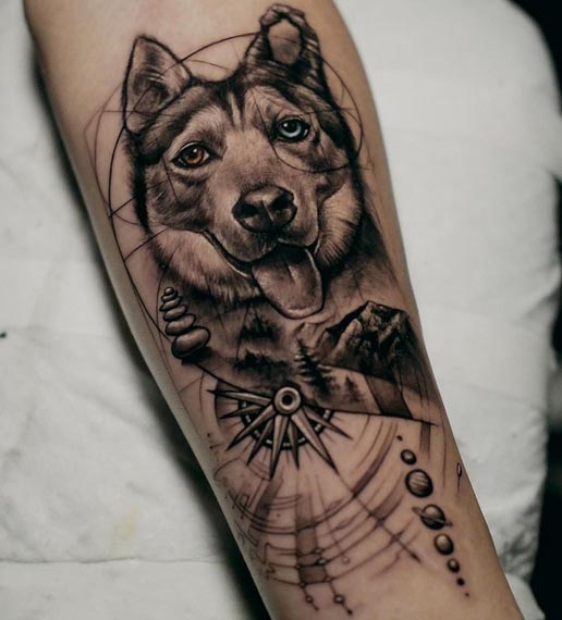 dog portrait compass mountains forest landscape trees planets orbit lines stars tattoo male forearm
