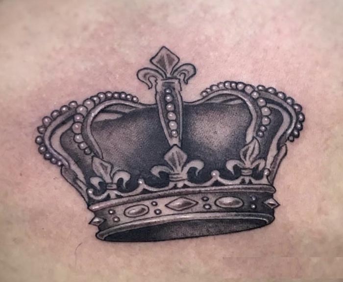 queen crown tattoo on chest