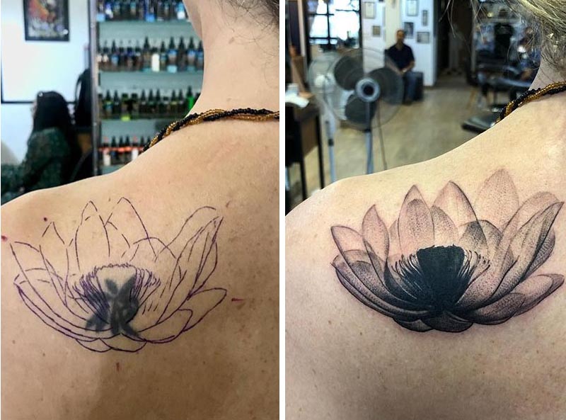 symbol cover up tattoo black lotus flower back shoulder