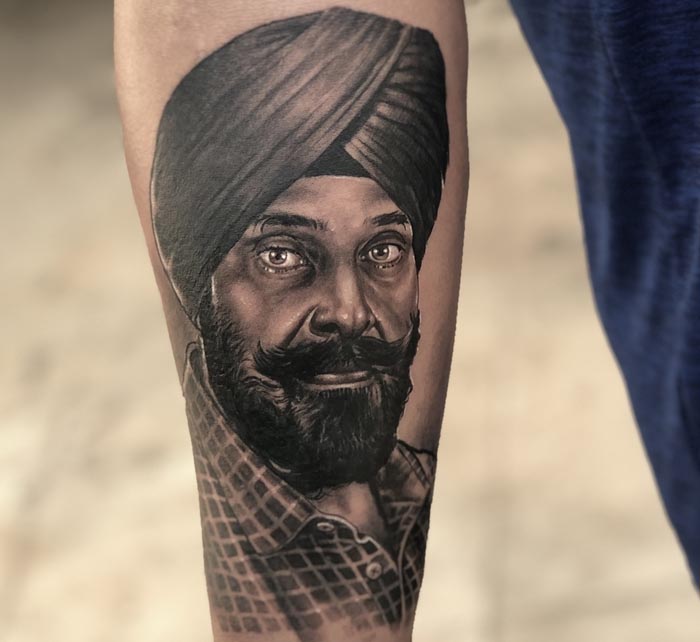 arm fathers portrait tattoo