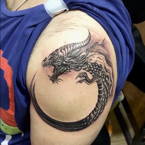 dragon enso shape tattoo boy bicep