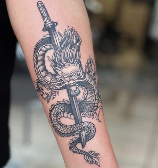 dragon japanese sword tattoo male forearm black and grey