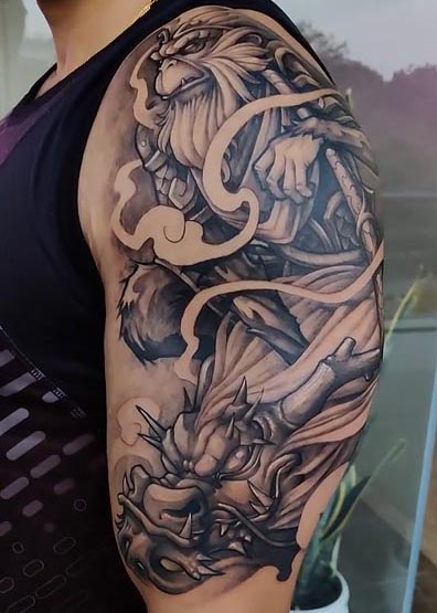 monkey king sun wukong and dragon tattoo design male bicep