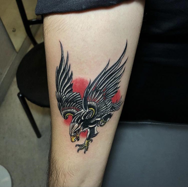 attacking eagle tattoo design male forearm