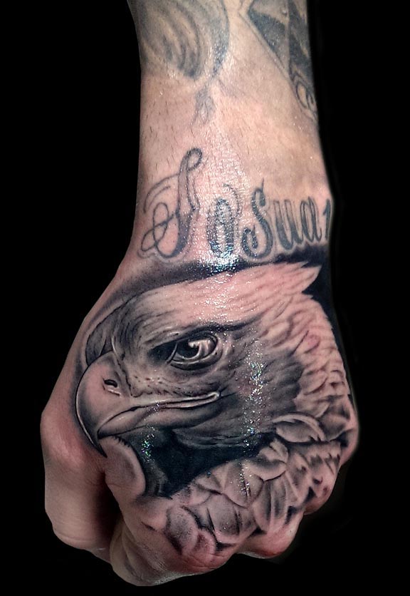 eagle head tattoo man hand black and grey