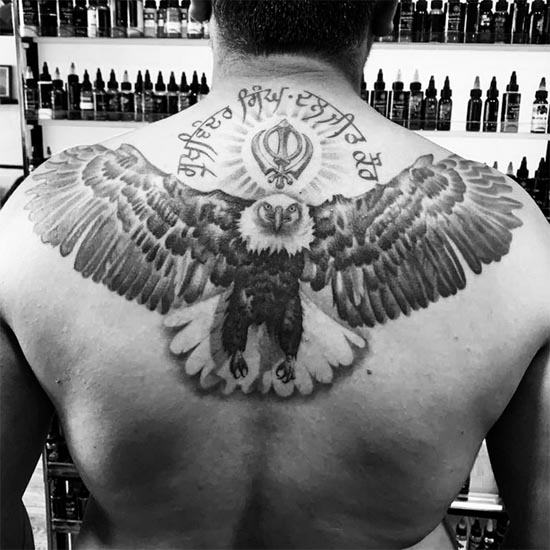eagle khanda punjabi text tattoo design black and grey male back