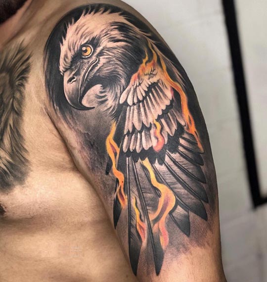 large eagle tattoo black and yellow male arm bicep