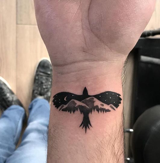 silhouette eagle travel tattoo design male hand wrist