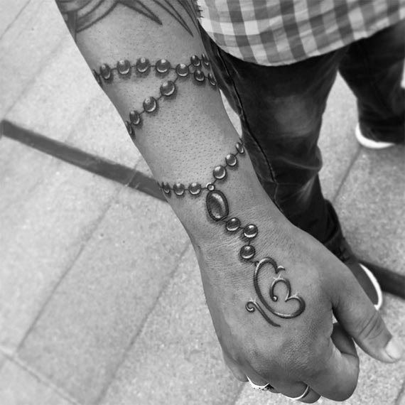 ek onkar rosary beads tattoo design male forearm wrist