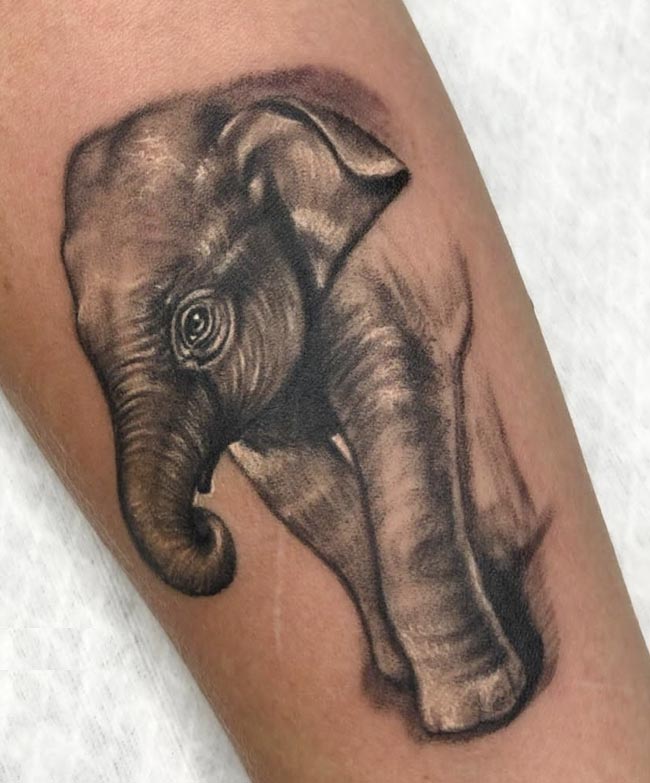 baby elephant tattoo on hand