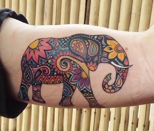 colorful abstract elephant tattoo idea man inner bicep