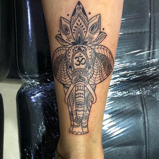 elephant flower at top tattoo mehndi style female calf