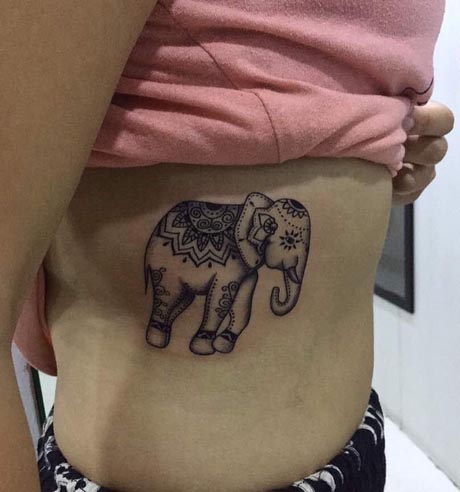 elephant tattoo using mehndi style female side