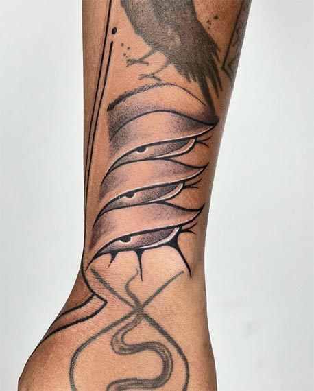 3 eyes tattoo female forearm