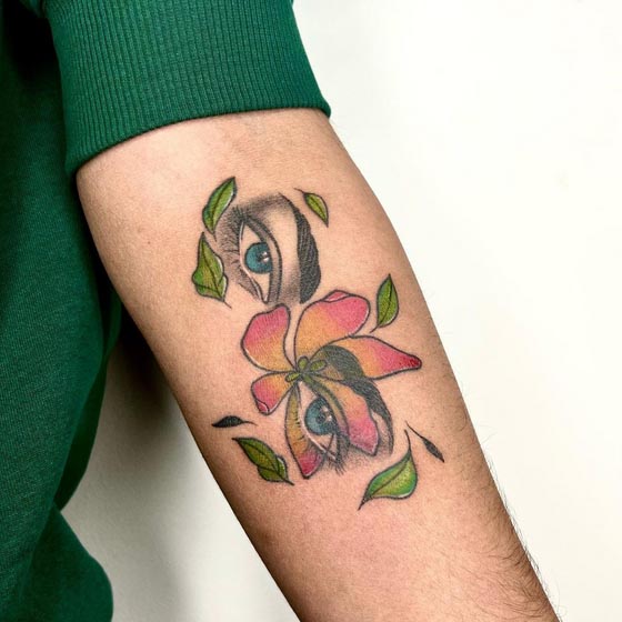 eye flower leaves color tattoo male forearm