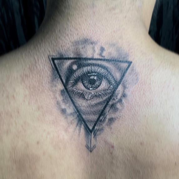 eye in inverted triangle small arrow at bottom tattoo design male back