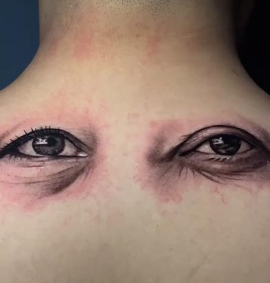 parents eyes tattoo design realistic male back