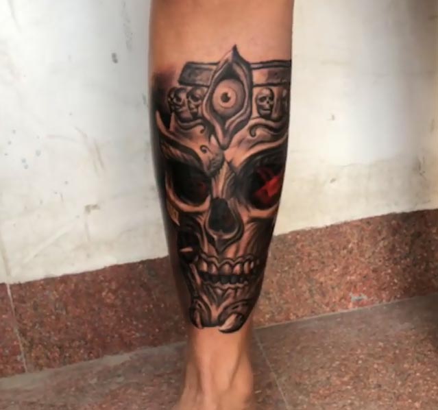 skull with third eye tattoo design male leg shin