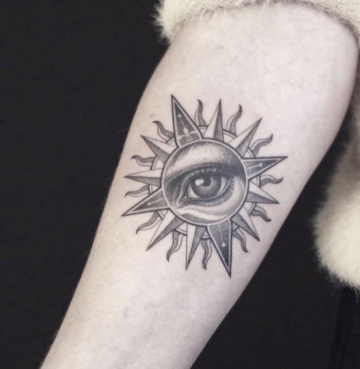sun eye tattoo design female forearm