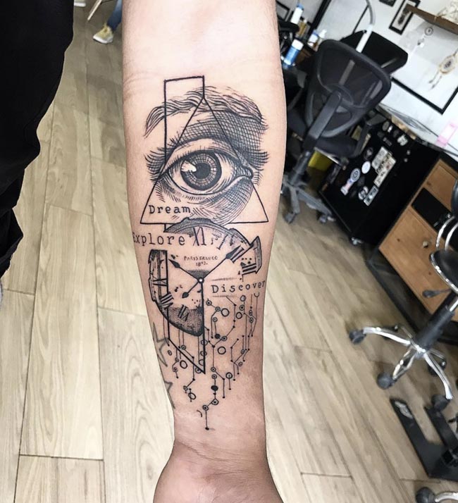 triangle eye clock electronic circuit words dream explore discover tattoo male forearm
