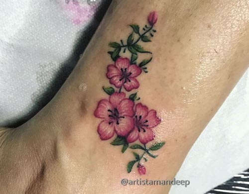 colorful ankle flower tattoo