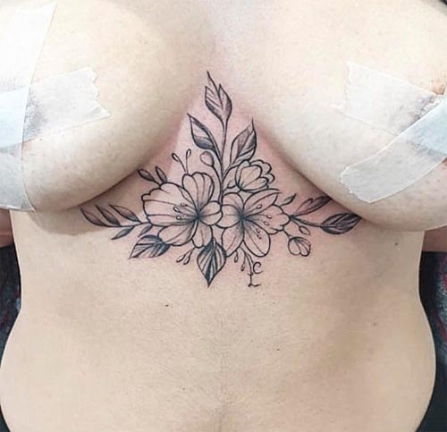 flowers blooming on chest tattoo design