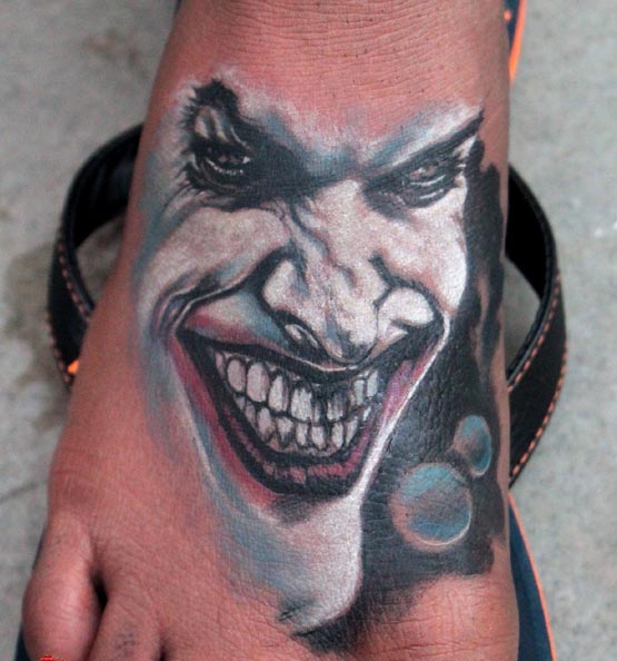 joker tattoo on foot