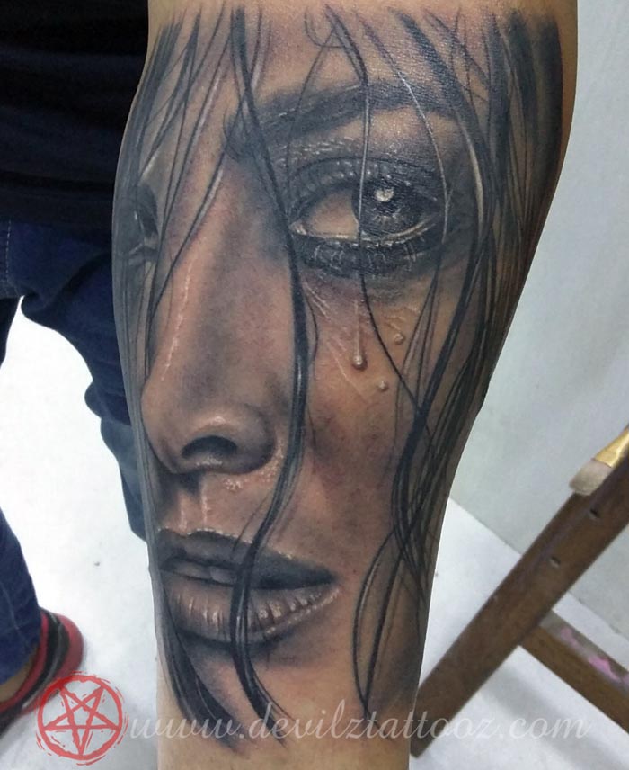 sad hurt girl face tattoo