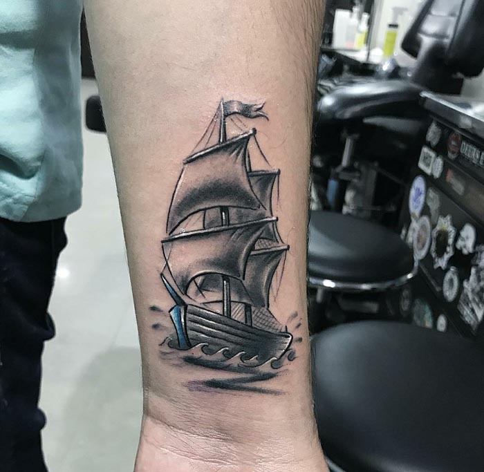 ship tattoo on forearm