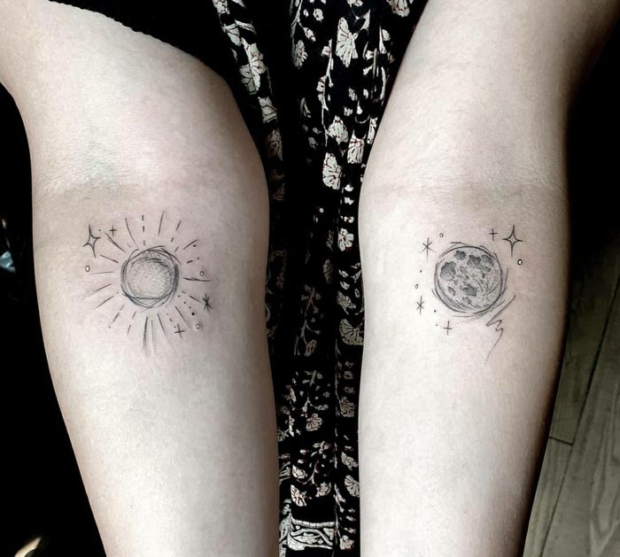 sun and moon tattoo on forearm
