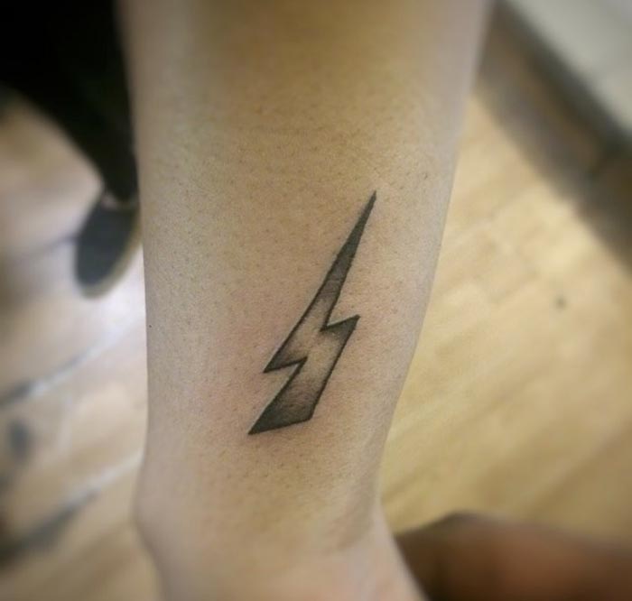 thunderbolt tattoo on forearm