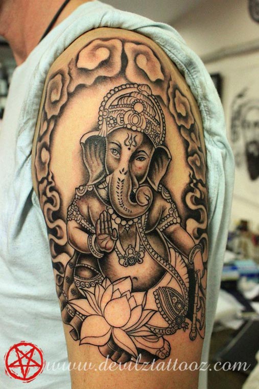 ganesha intricate lotus tattoo art