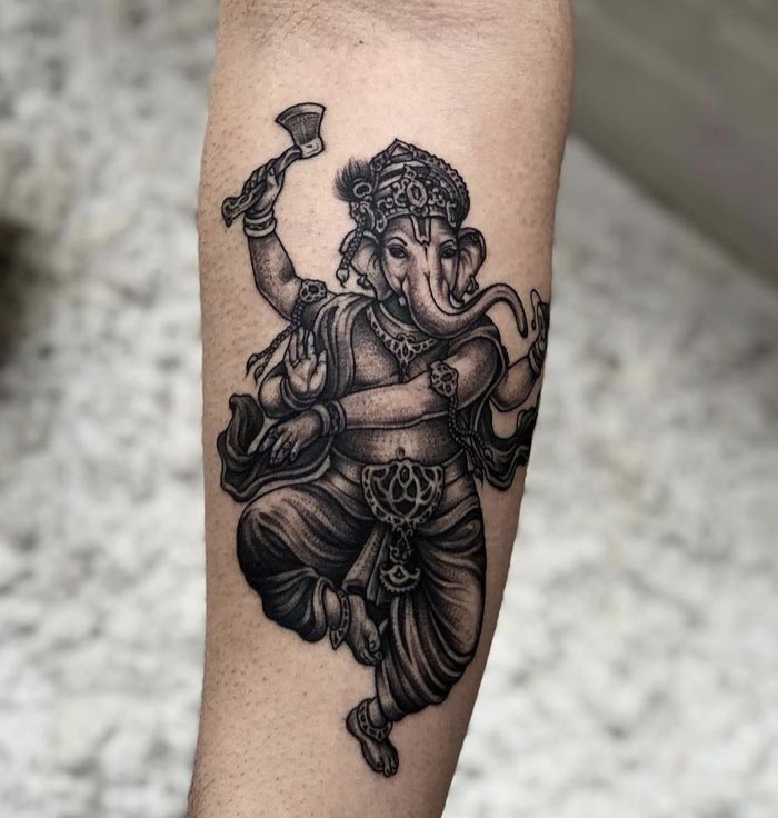 ganesha with axe tattoo on arm
