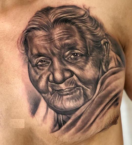 chest grandmothers portrait tattoo