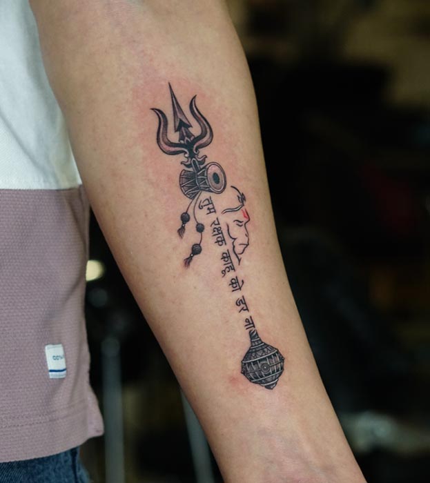hanuman side face with trishul damru gada tattoo man forearm