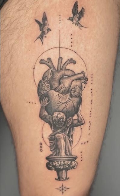 atlus holding heart-tattoo design male leg thigh