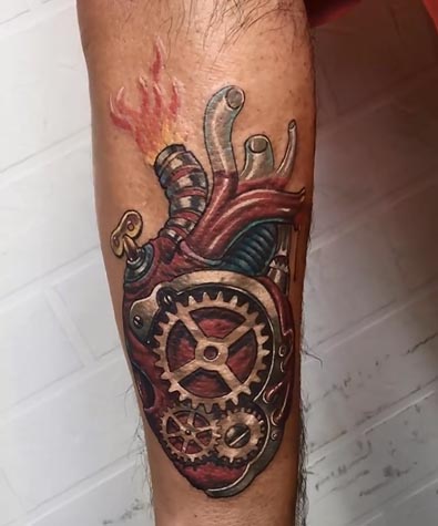 biomechanical heart tattoo design male forearm