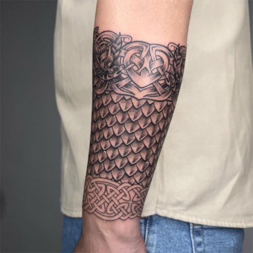 celtic heart knot pattern tattoo male forearm half sleeve