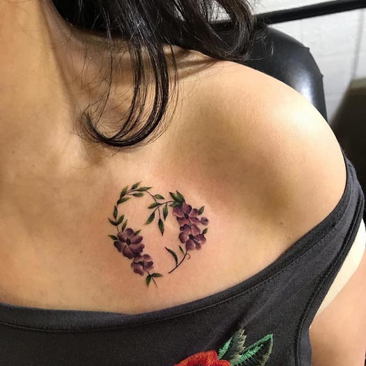flowers leaves in heart shape minimalist tattoo design female collarbone