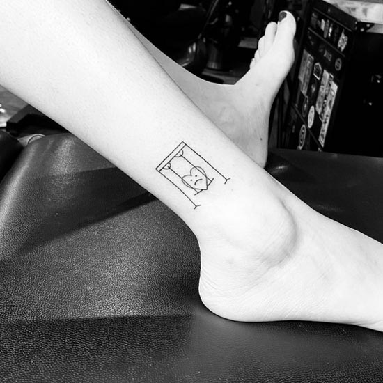 heart on hammock swinging tattoo design line art female leg