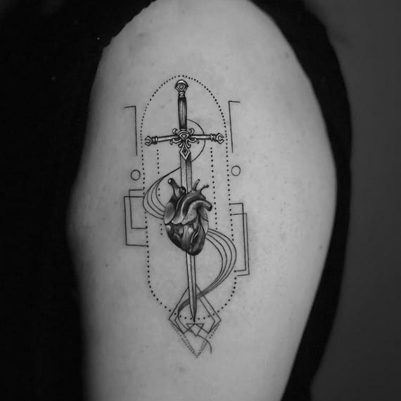 heart over sword other geometric shapes tattoo female bicep