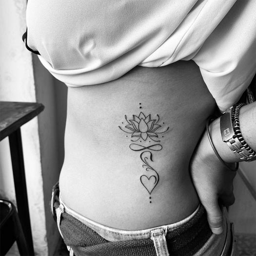 lotus infinity heart tattoo linework minimalist female side