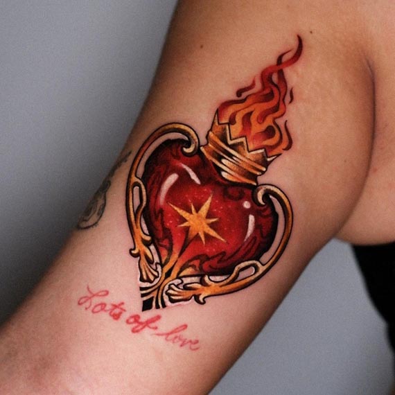 sacred heart quote lots of love color tattoo design female hand bicep