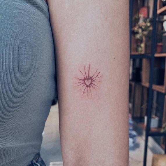 splash heart tattoo design color minimalist female bicep