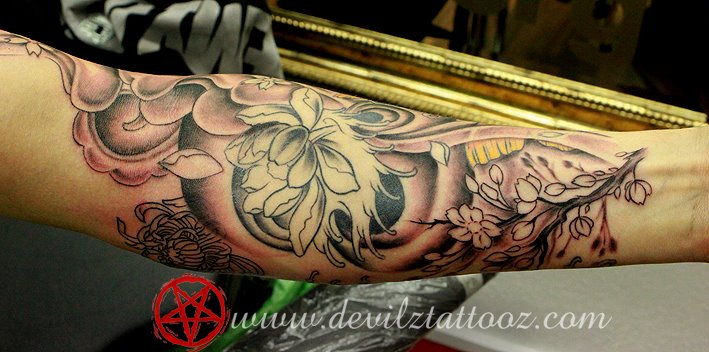 Japanese floral tattoo on forearm