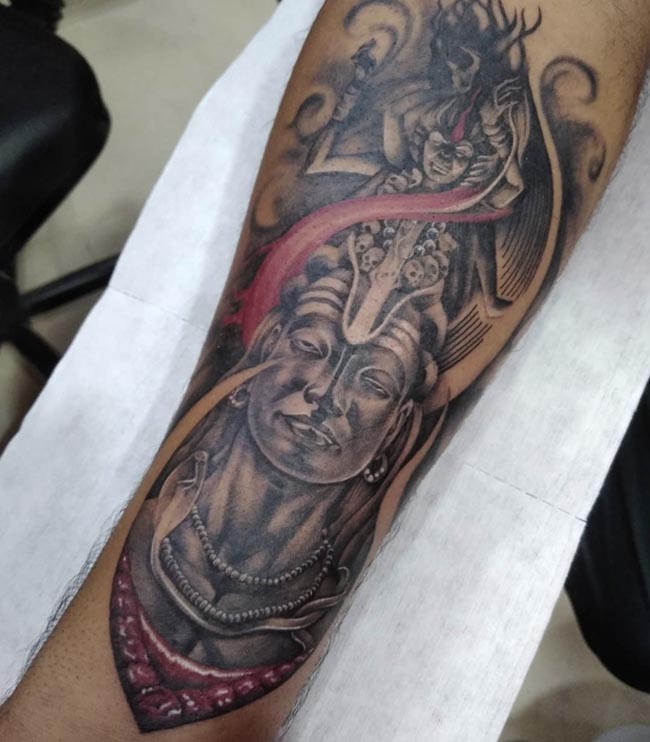 aadi yogi shiva beneath maa kali tattoo male forearm