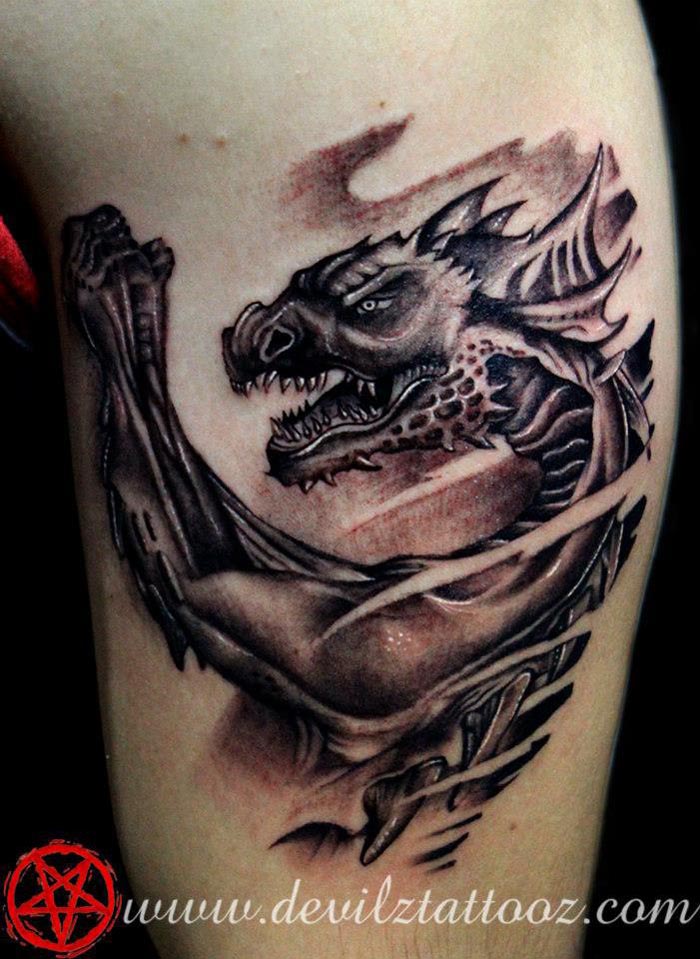 dragon tattoo on leg