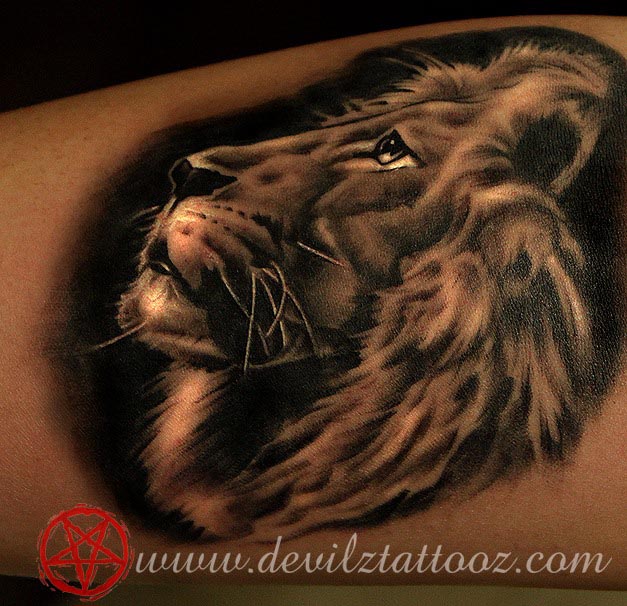 lion tattoo on leg