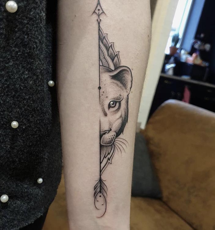 arrow half lioness face tattoo girl forearm